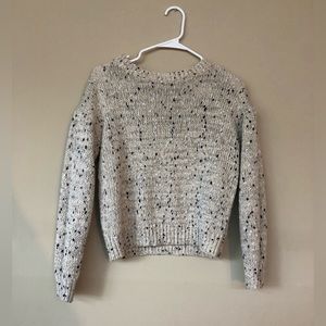 A gently used knitted cardigan